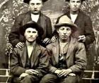 Emmettdalton and jesse james standing jesse evans and frank james seated